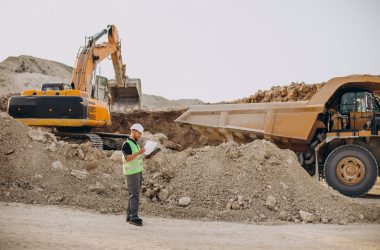 male worker with bulldozer in sand quarry male worker with bulldozer in sand quarry